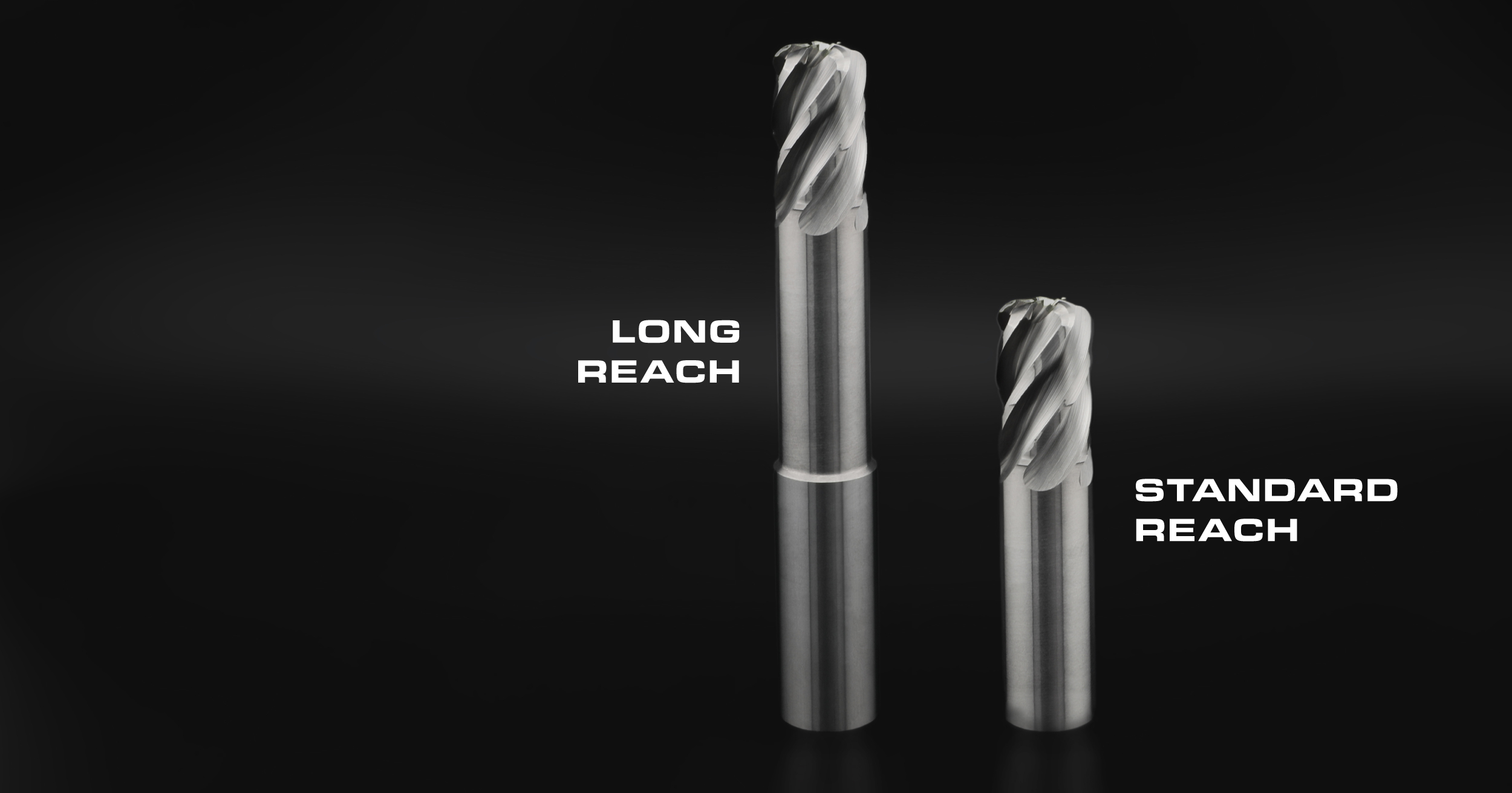 Side-by-side comparison of a long-reach custom carbide end mill and a standard-reach solid carbide end mill, showing the neck length difference between catalog and custom configurations